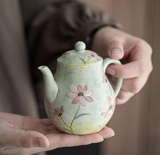 Ceramic teapot with hand-painted daisies