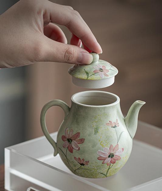Ceramic teapot with hand-painted daisies