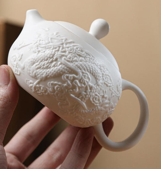 Embossed mutton-fat jade Xishi pot