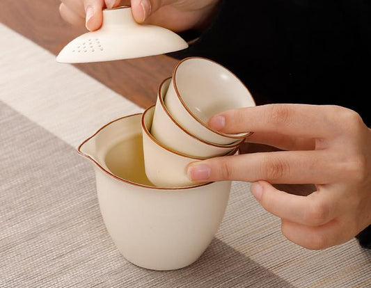 Portable travel tea set with one pot and three cups