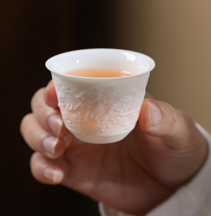 Embossed mutton-fat jade Xishi pot