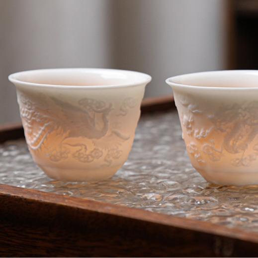 Embossed mutton-fat jade Xishi pot