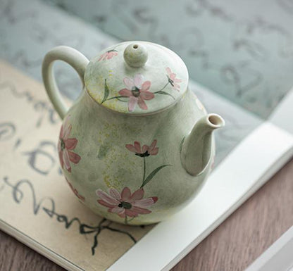 Ceramic teapot with hand-painted daisies